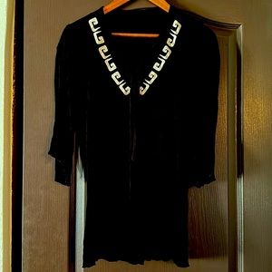 Beautiful Light flowy, unique top! Women’s/ Juniors fits xs-medium.